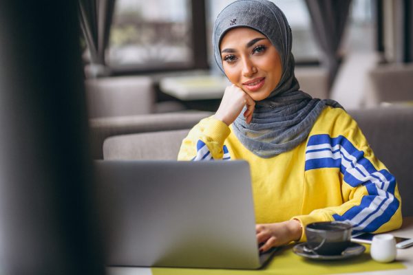 arabian-woman-hijab-inside-cafe-working-laptop-scaled-1.jpg