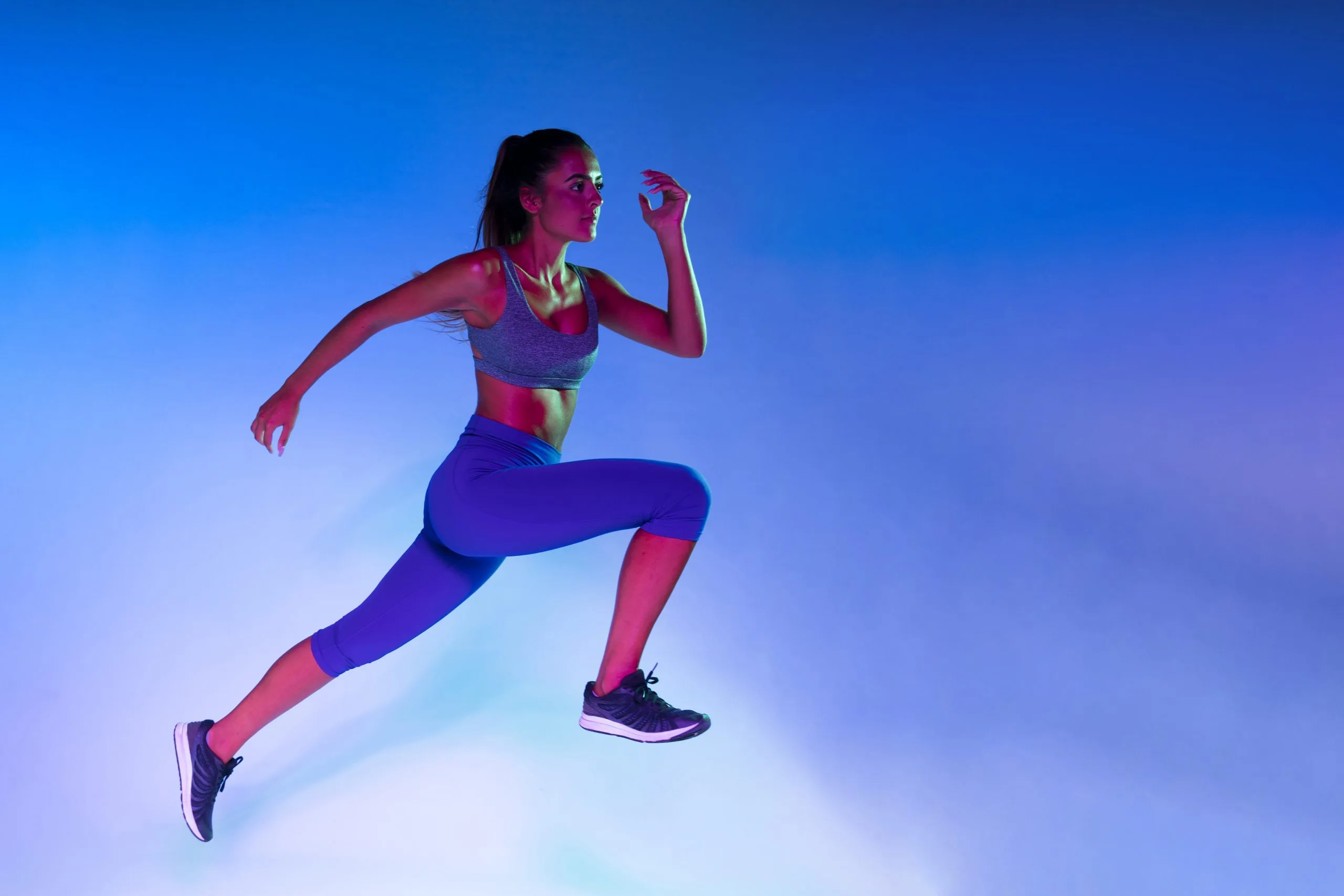 side-view-athlete-training-with-blue-background-scaled-1-jpg.webp